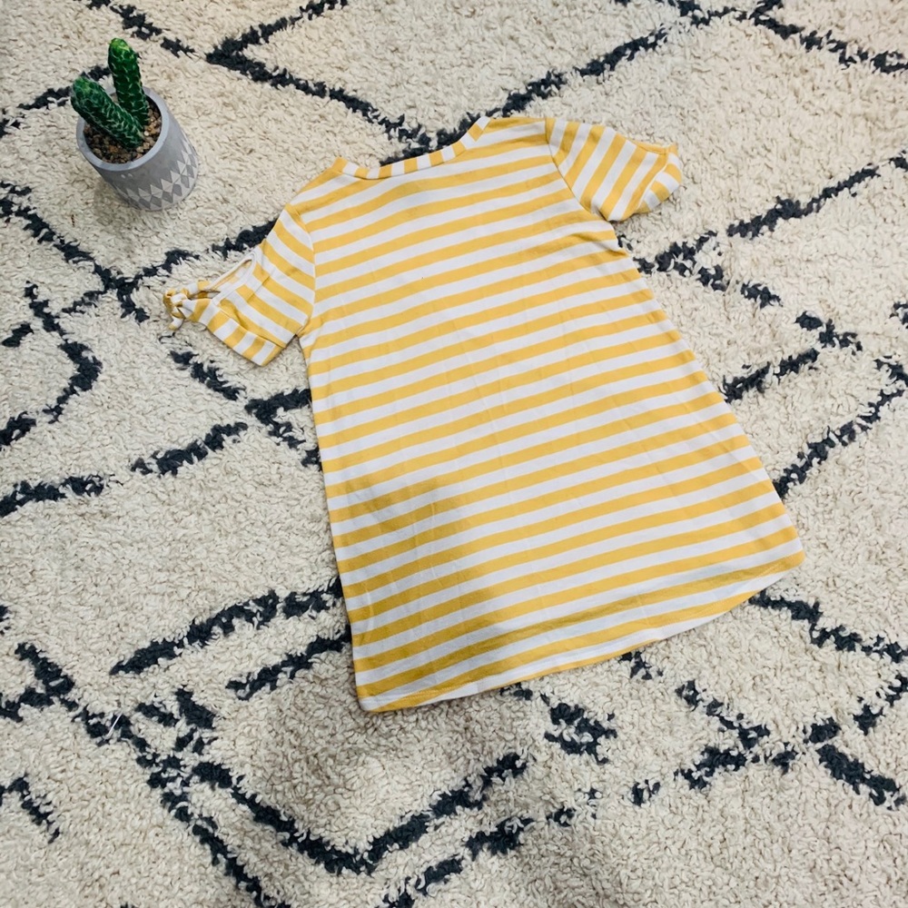 yellow striped top, with a sleeve cut out